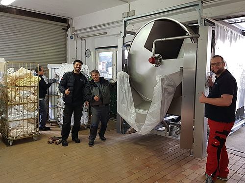 Carefully maneuvering the new equipment into position